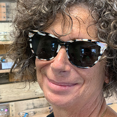 woman smiling with new sunglasses