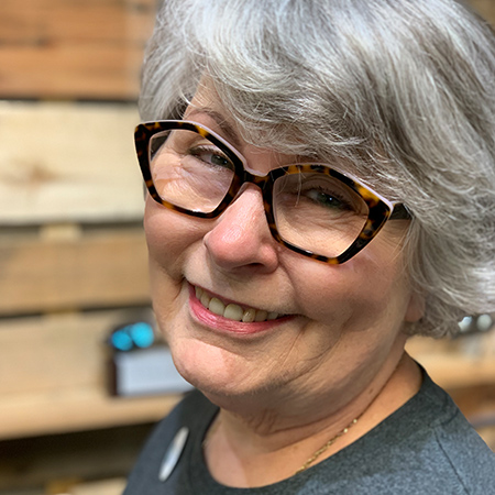 woman smiling with new eyeglasses