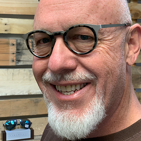 man smiling with new eyeglasses